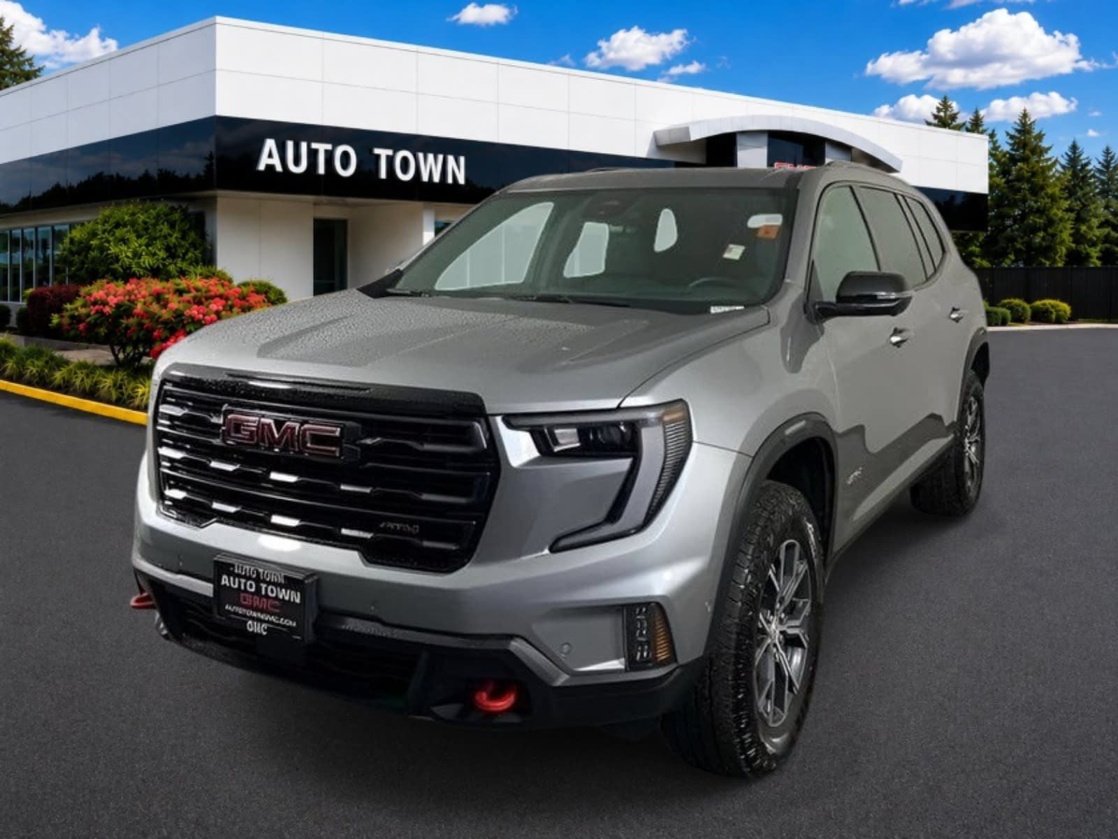 2024 GMC Acadia AWD AT4 in Sterling Metallic — front three-quarter view