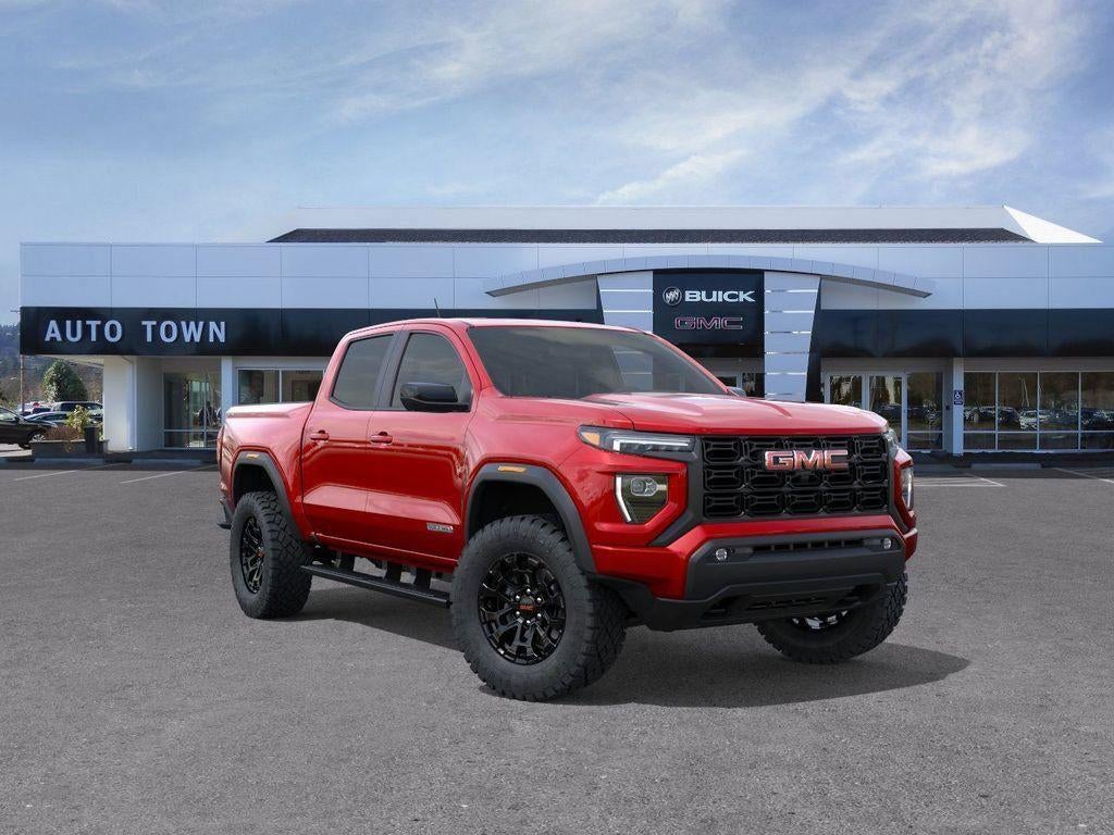 2026 GMC Canyon Crew Cab Short Box 4-Wheel Drive Elevation in Volcanic Red Tintcoat — front three-quarter view