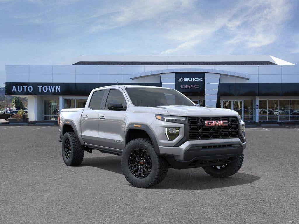 2026 GMC Canyon Crew Cab Short Box 4-Wheel Drive Elevation in Sterling Metallic — front three-quarter view