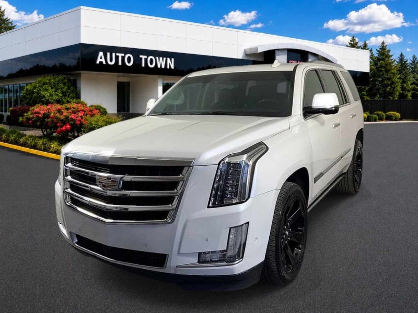 2017 Cadillac Escalade 4WD Premium Luxury in Crystal White Tricoat — front three-quarter view