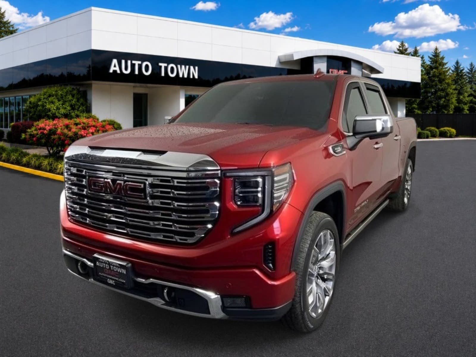 2023 GMC Sierra 1500 Crew Cab Short Box 4-Wheel Drive Denali in Volcanic Red Tintcoat — front three-quarter view